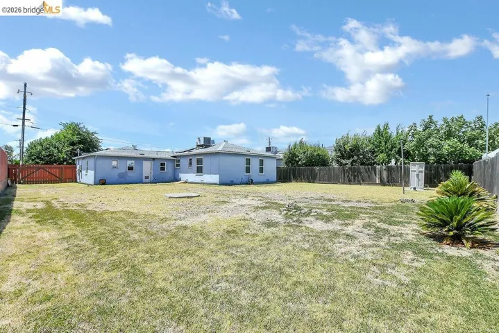 Expansive backyard featuring a fenced perimeter.