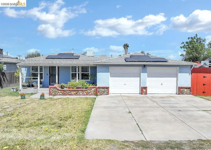 Light blue exterior with white trim and a two-car garage