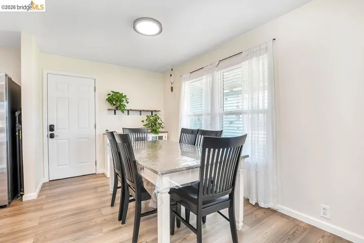 Dining area featuring vinyl flooring and neutral wall tones