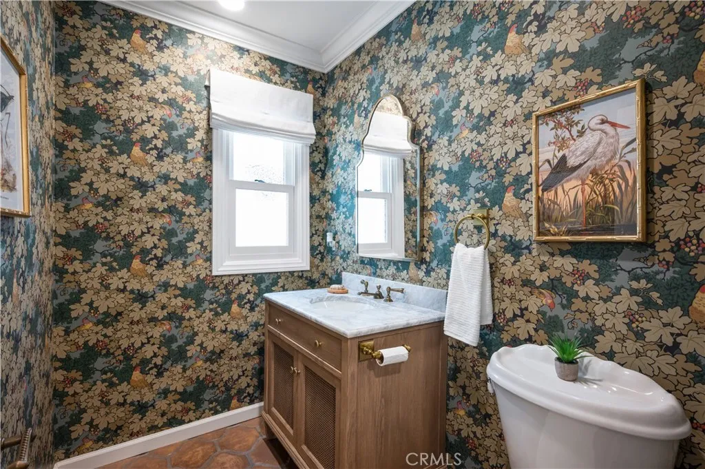 Adorable powder room downstairs which is great when entertaining.
