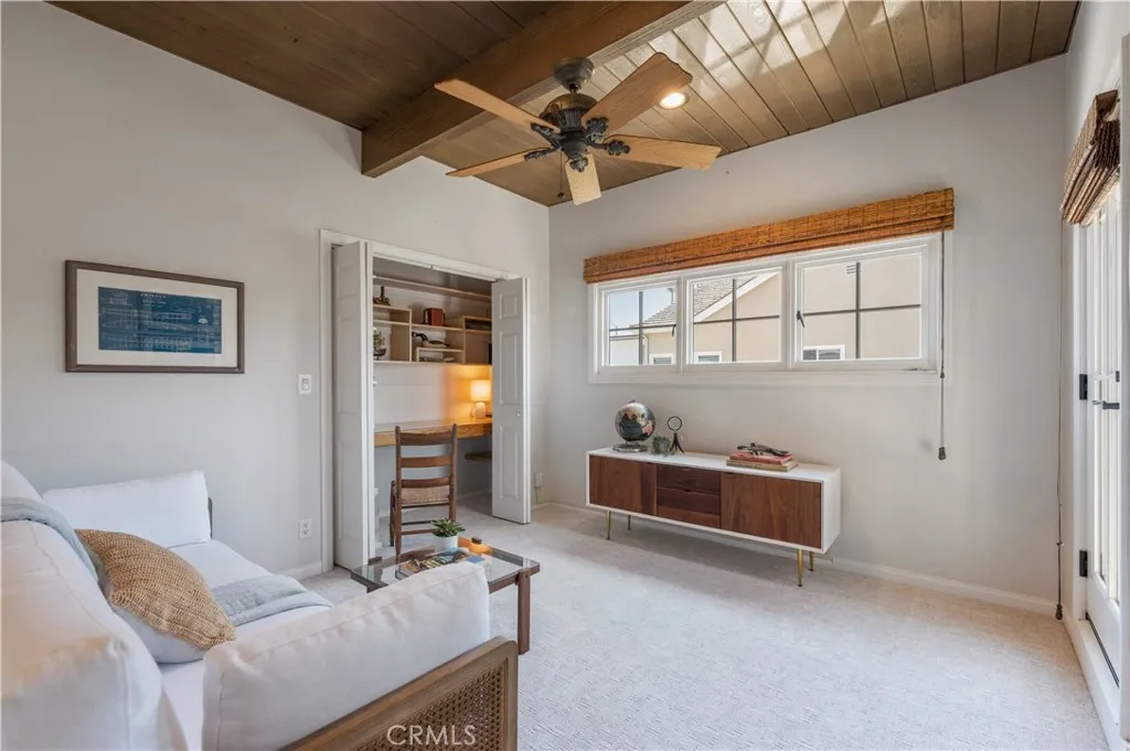 Make this room into an office or bedroom. This space features its own private balcony and loads of fresh sunlight.