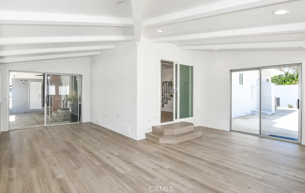 Flex space with sliding doors to a courtyard and the backyard (pictured to the right)