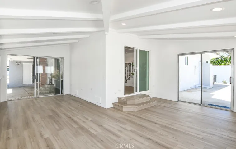 Flex space with sliding doors to a courtyard and the backyard (pictured to the right)