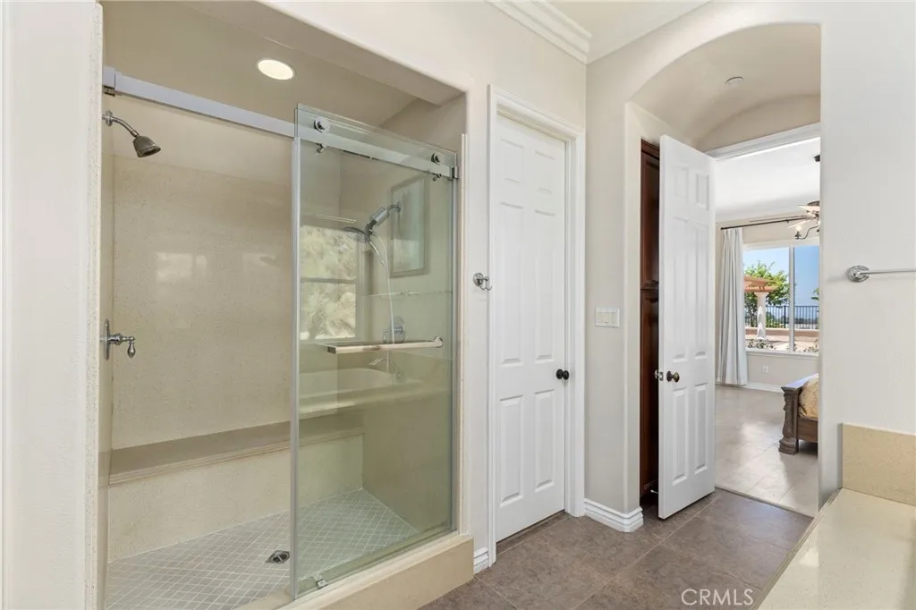 Double headed master shower with quartzite bench