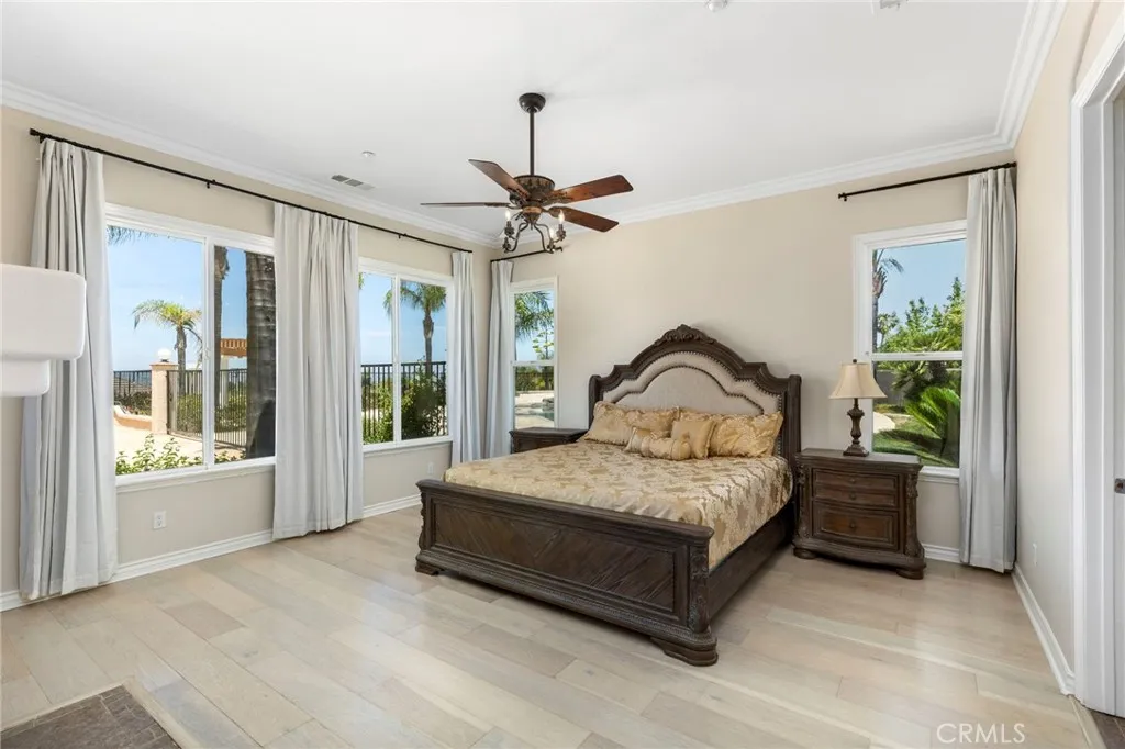 Spacious master bedroom with pool view