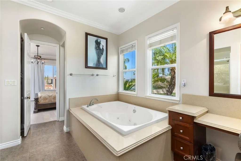 Master bathroom with pool & garden view