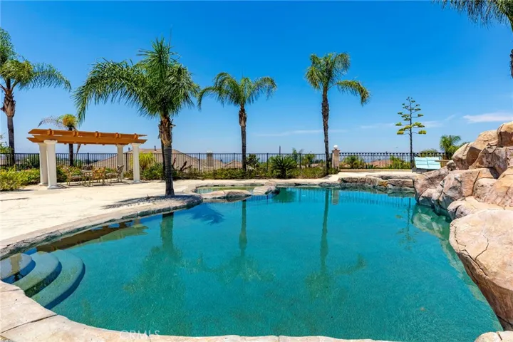 Large salt water pool with patio and views