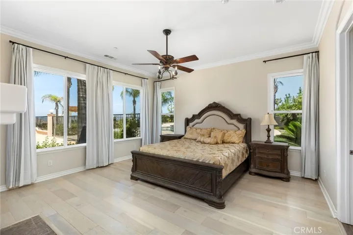 Spacious master bedroom with pool view