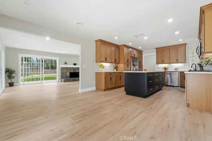 VIEW FROM DINING AREA OF KITCHEN AND GREAT ROOM