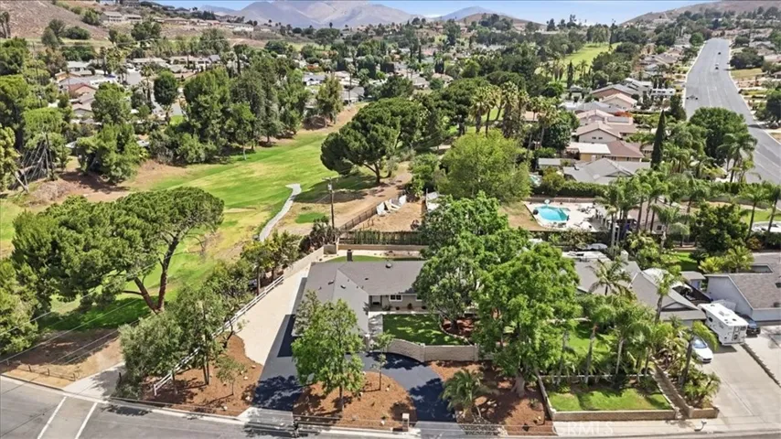 AERIAL VIEW OF HOME AND NEIGHBORING GOLF COURSE