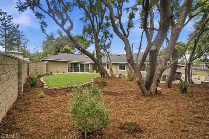 FAR CORNER OF COURTYARD LOOKING TOWARDS FAMILY ROOM