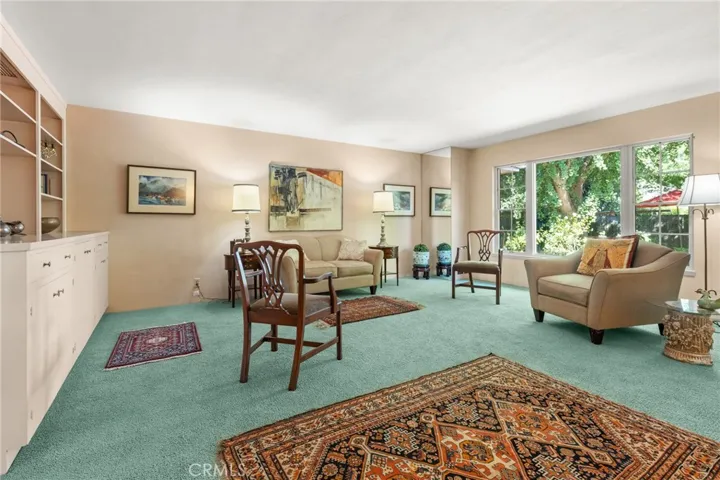 Front room. big window looking out to backyard.