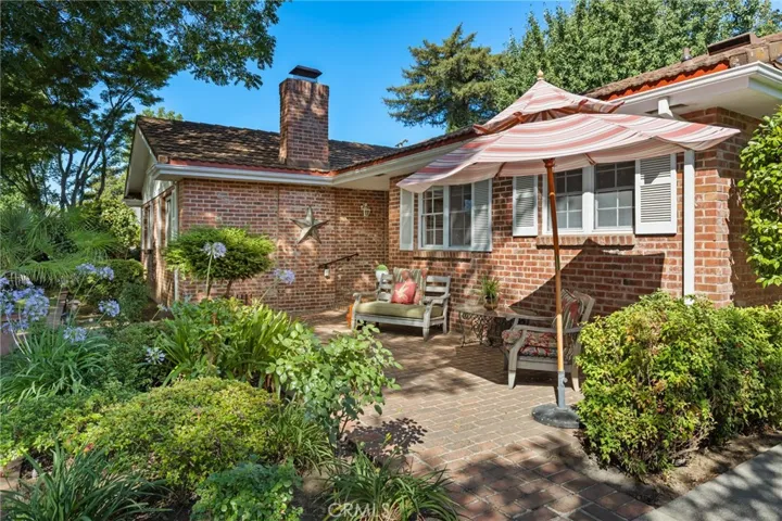 Front yard with a brick porch.
