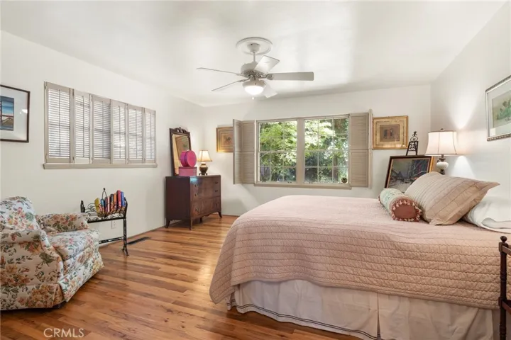 Primary room with lots of light. Wood floors.