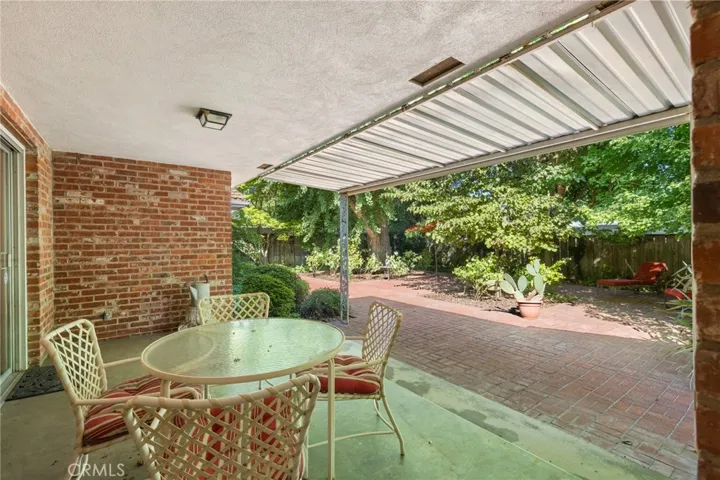 Covered porch in backyard.