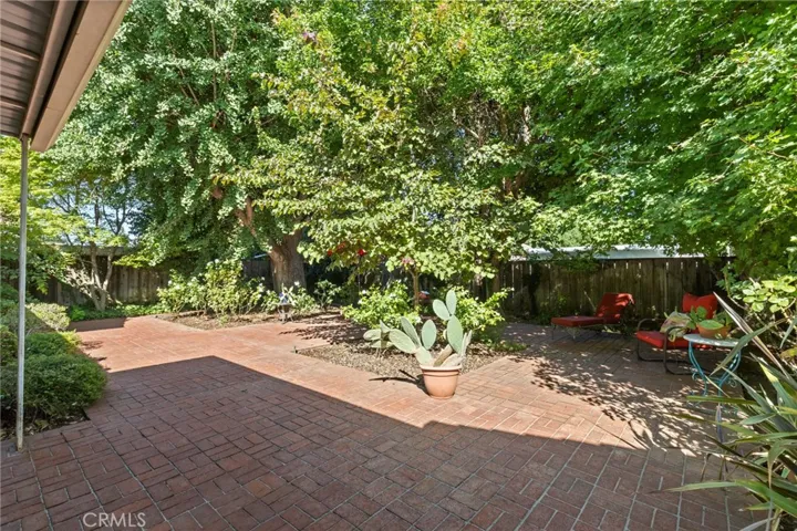 Brick porch and walkways in the backyard.