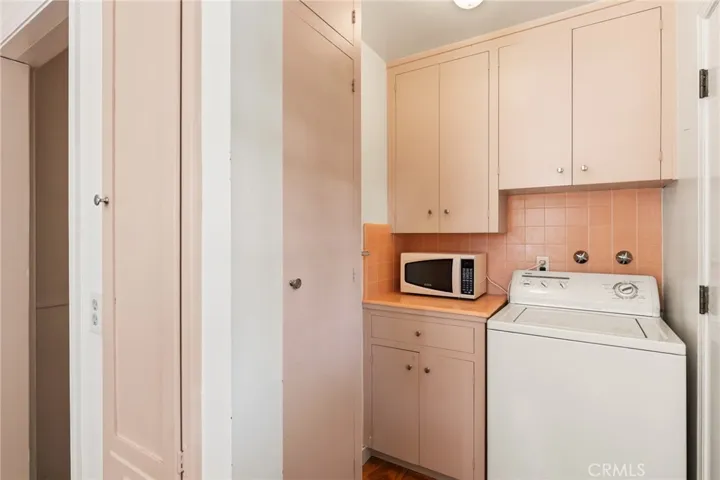 Laundry area. Built-in ironing board.