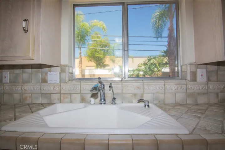 Kitchen overlooks backyard