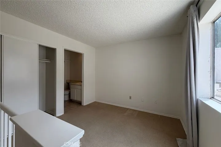 Loft with closet and bathroom