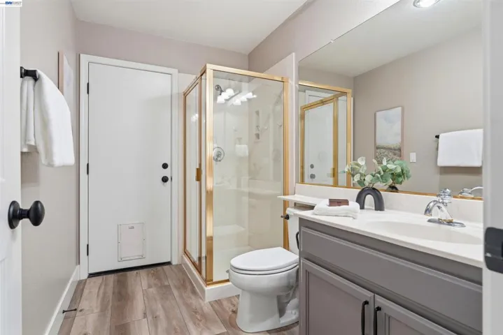 downstairs full bath with door to backyard