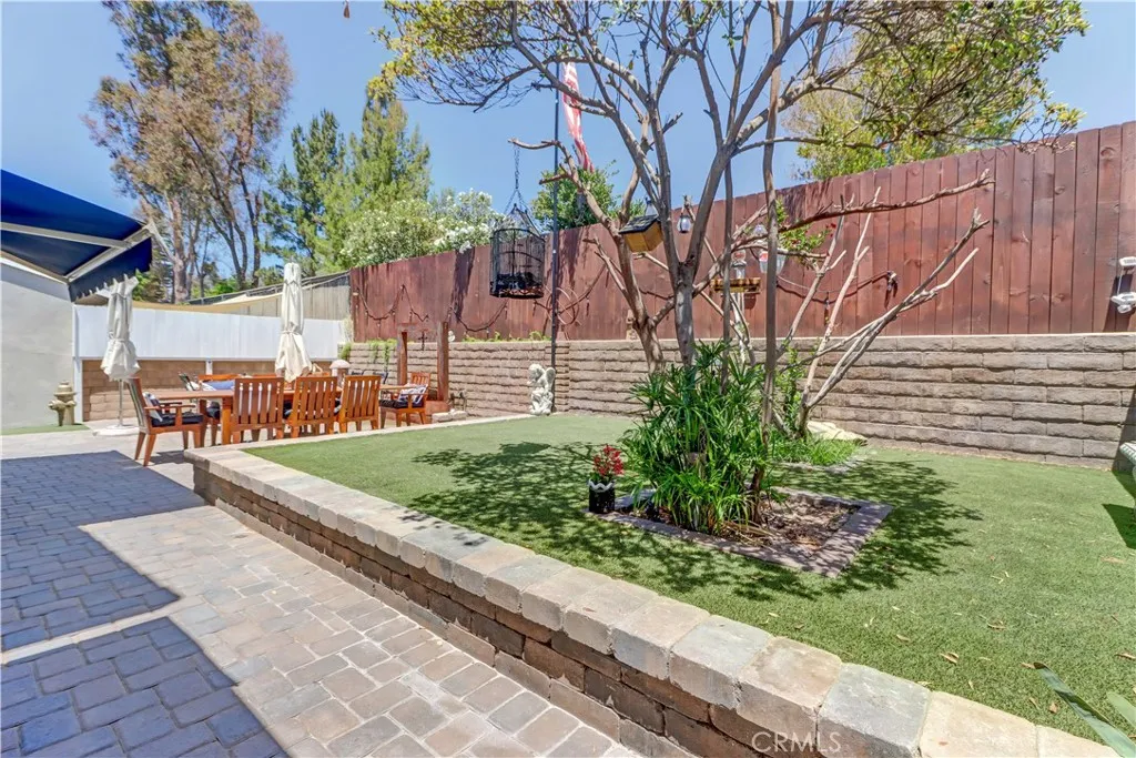 Raised grassy turf area in back yard