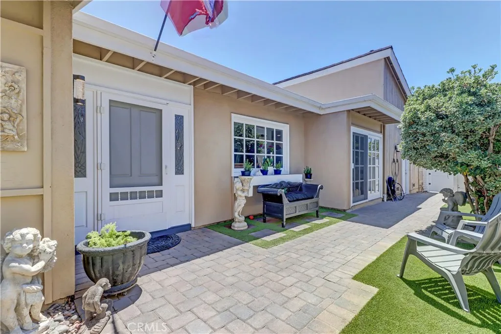 Enclosed Front Courtyard that wraps to backyard- all with upgraded brick patios