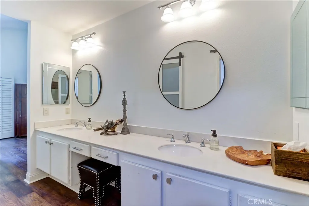 Primary vanity area that opens to primary suite