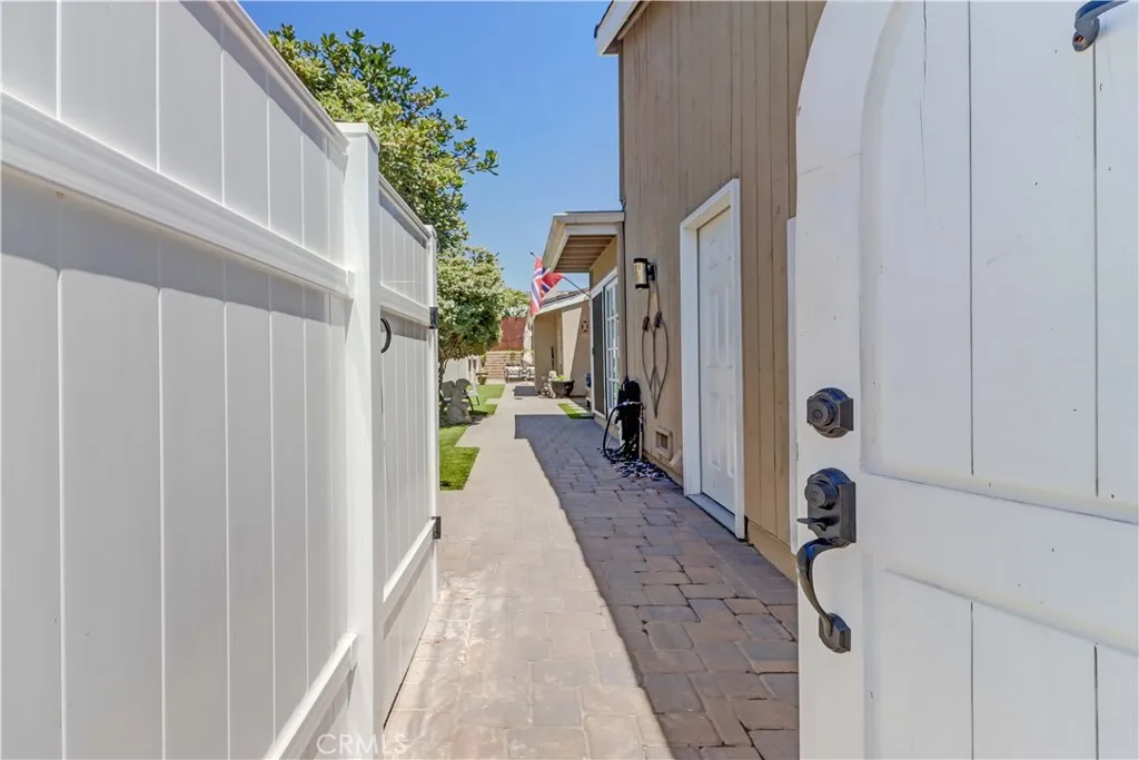 Front Entrance- door to left is an enclosure for trash cans so they are hidden away