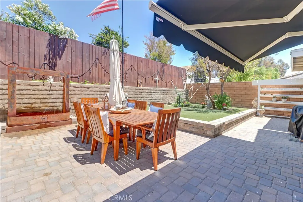 Electric extendable patio cover- Entire patio area with upgraded brick