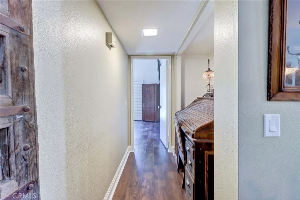 Hallway to Primary bedroom which is on the opposite side of the house from the other two bedrooms