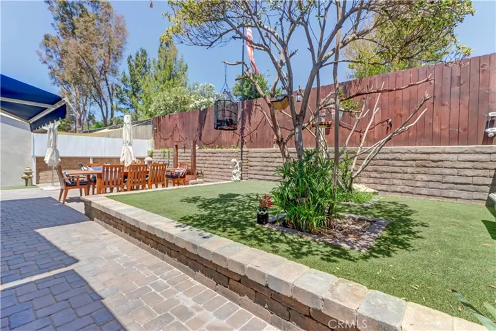 Raised grassy turf area in back yard