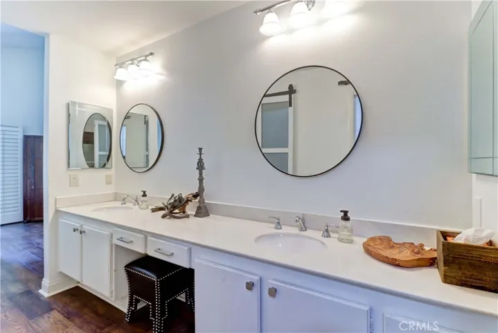 Primary vanity area that opens to primary suite