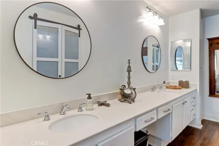 Primary Bathroom has two sinks and vanity area- separate from toilet and shower area