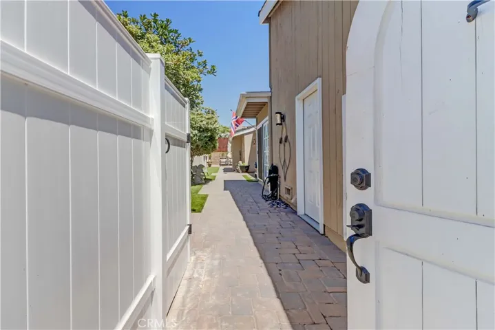 Front Entrance- door to left is an enclosure for trash cans so they are hidden away