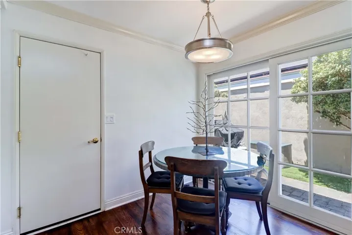 Informal Dining area opens to kitchen and sliding door to front courtyard