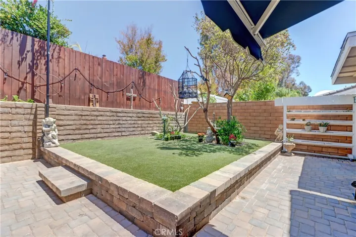 Grassy Turf area with rolling plant stand on right