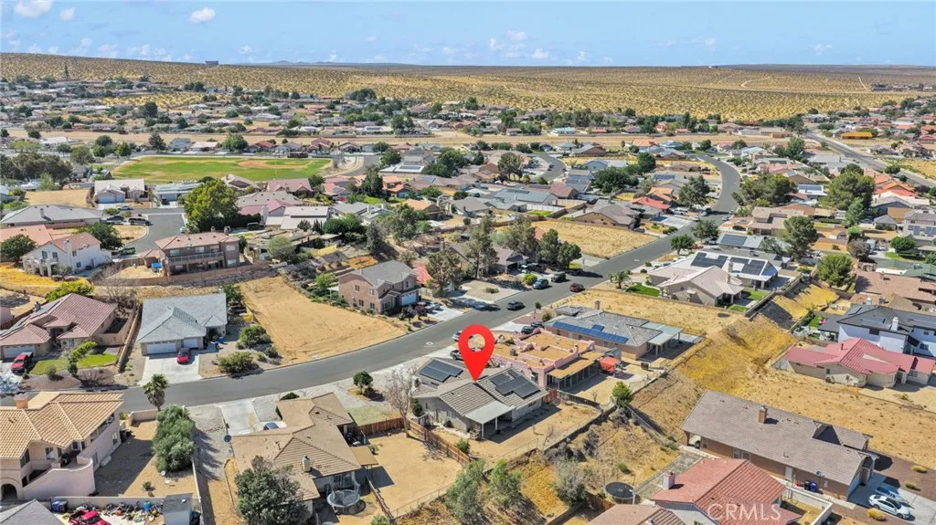 High-altitude aerial overview showing the property position and close proximity to North Lake, offering easy access to the waterfront.