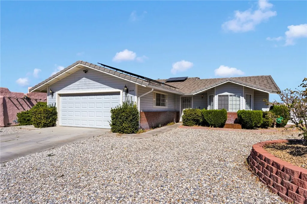 Beautifully updated open-concept desert home showcases exceptional architectural depth, an attached garage, and a spacious, low-maintenance front yard.