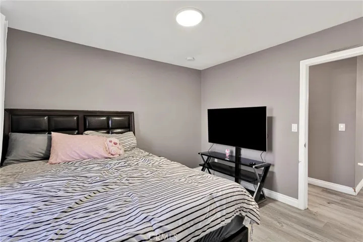 Alternate angle of the second bedroom demonstrating the flexible floor plan space and easy access to the main hallway.