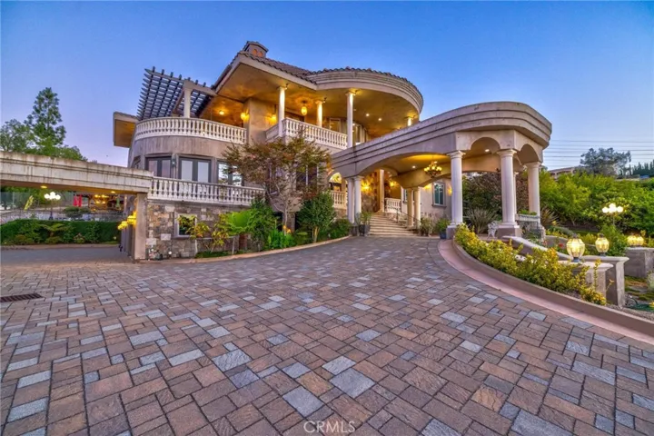 Grand entrance and expansive parking