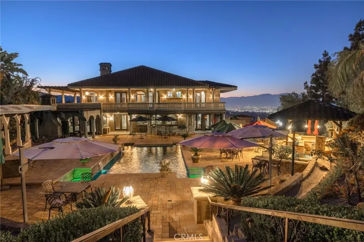 Pool and City light views surround this home
