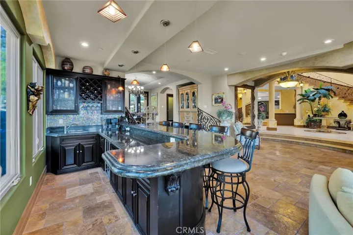 LIVING ROOM WITH LARGE CUSTOM BAR