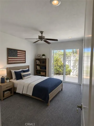 Bedroom #2 with virtual furniture. Furniture and décor have been digitally added for illustrative purposes only and are not included with the property.