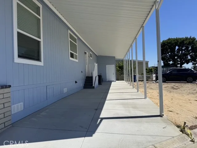 view of driveway and carport reserved parking
