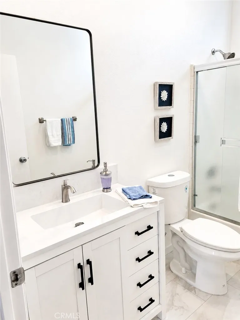 newly remodeled hall bath vanity and floor