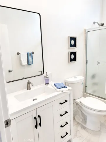 newly remodeled hall bath vanity and floor