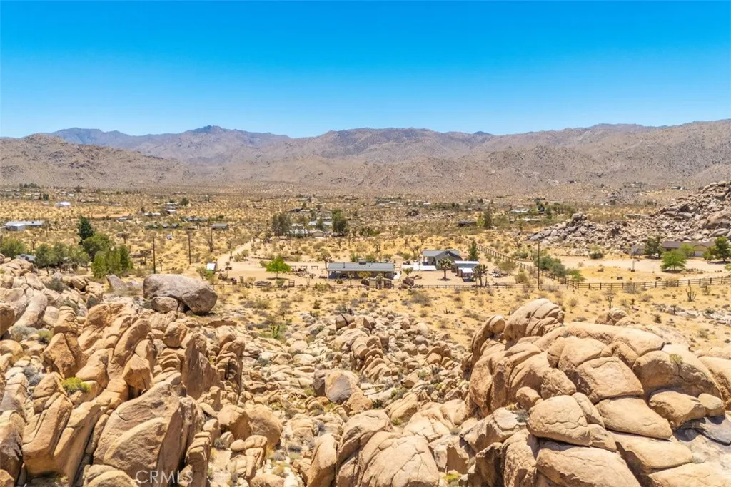 Views from the boulders looking south, showcasing the wide-open desert landscape and breathtaking scenery.
