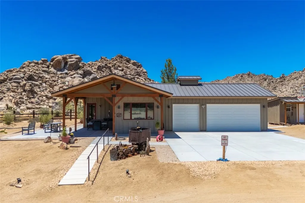 Guest house and finished three-car garage, thoughtfully positioned to provide both privacy and functionality.