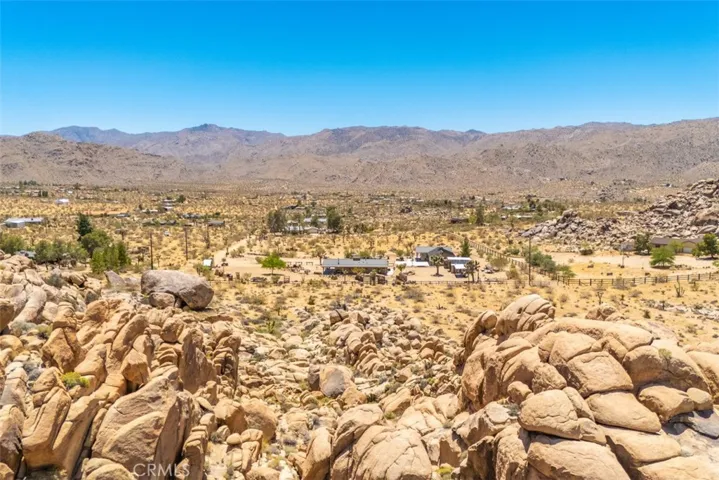 Views from the boulders looking south, showcasing the wide-open desert landscape and breathtaking scenery.