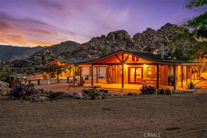Main house with the guest house in the background.

Not AI-generated. These stunning twilight photos were captured by a professional photographer during an actual twilight setting.